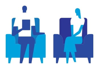 Two people sitting on chairs icon