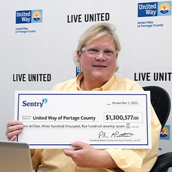 Woman Holding Donation Check