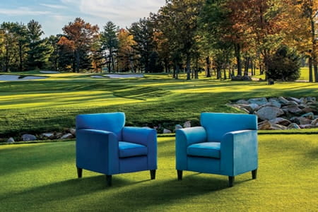 Sentry blue chairs on a golf course