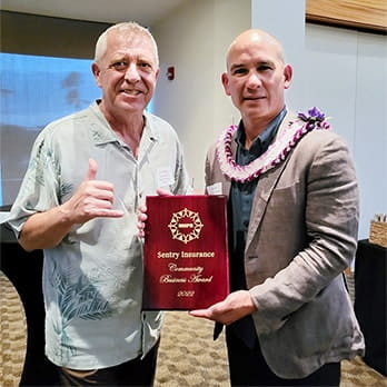 Paul Tonnessen and Max Novena with Sentry's Nonprofit award